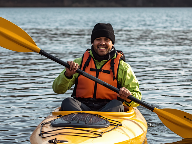 Kayaker wearing PFD in cold water