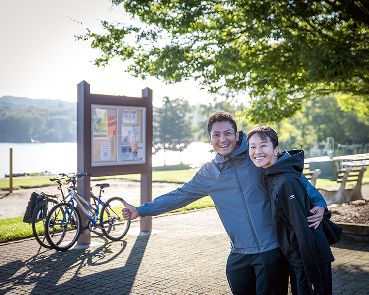 Two participants give the thumbs up after the Lake Loop bike, run, paddle