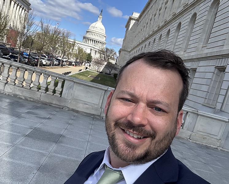 Kyle in front of Capitol Hill