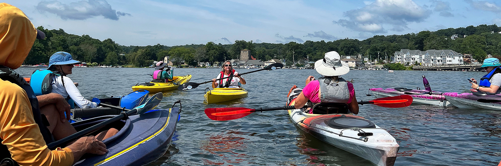 A slide of paddlers on a group paddle on Lake Hopatcong